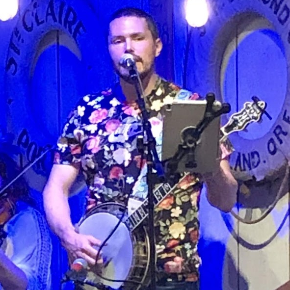 Crimulus playing banjo at a gig